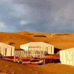 Traditional Berber camp under starry Saharan sky