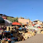 Marrakech travel guide with vibrant market scenes and historical sites